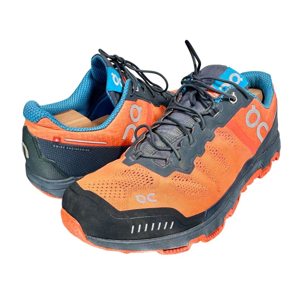 On Running Orange and Black Athletic Shoes